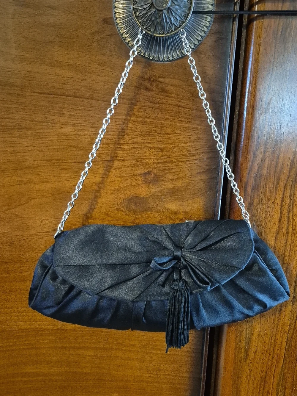 Vintage: A black satin foldover evening bag. Satin Bow& Rusch Pleating &tassels